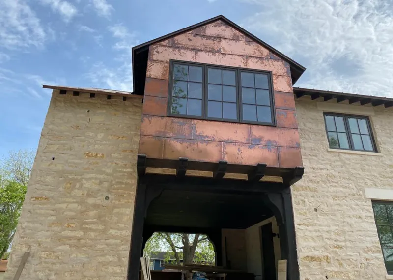 Copper metal panel facade on a stone building for Skylight Installation in Ellicott City